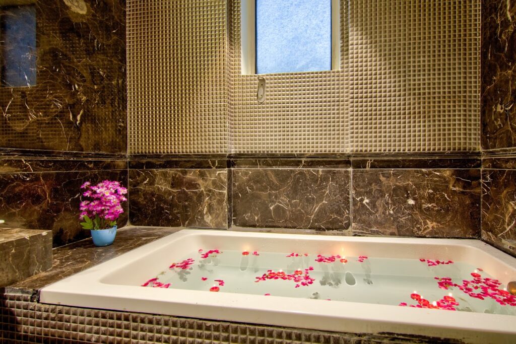 Luxury room with bathtub at Hotel GreySky South Delhi